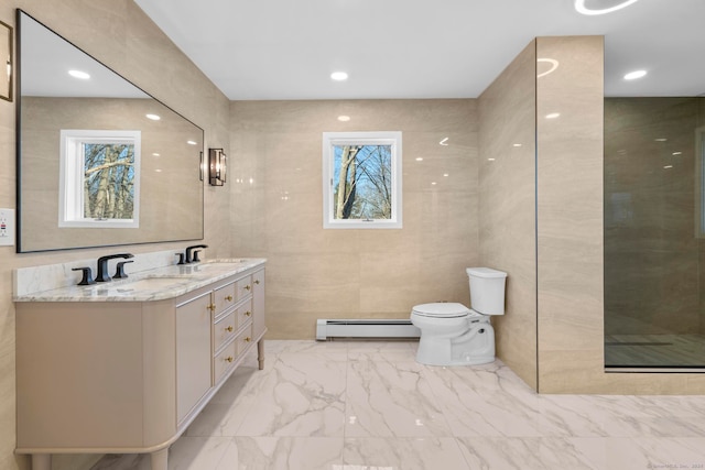 bathroom featuring vanity, toilet, tile walls, a baseboard radiator, and an enclosed shower