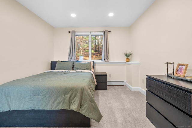 carpeted bedroom with baseboard heating