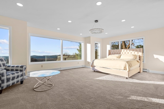 carpeted bedroom featuring multiple windows and a baseboard radiator