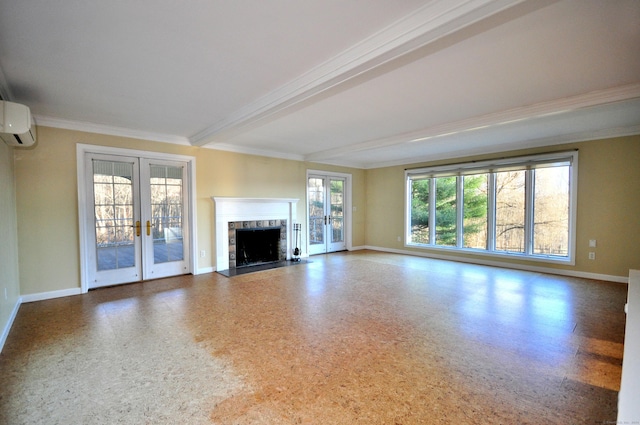 unfurnished living room with a wall mounted air conditioner, french doors, beamed ceiling, a fireplace, and baseboards