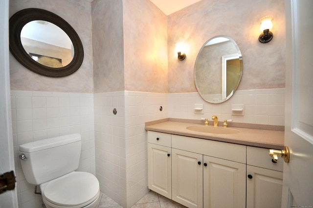 bathroom with tile walls, toilet, and wainscoting