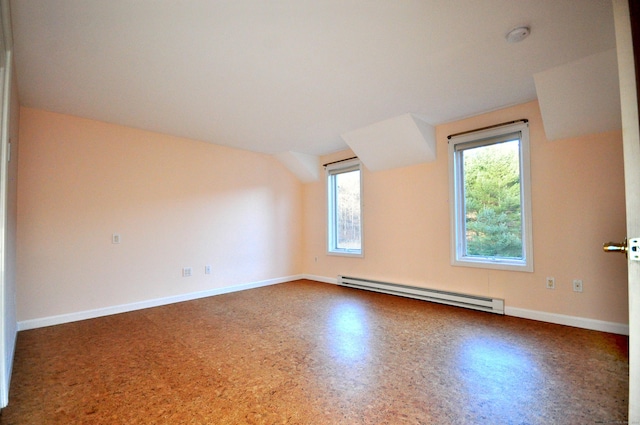 additional living space featuring baseboards and a baseboard radiator