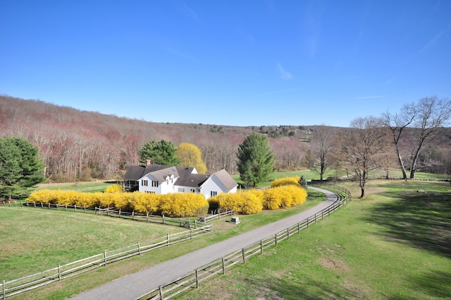 aerial view with a rural view and a wooded view