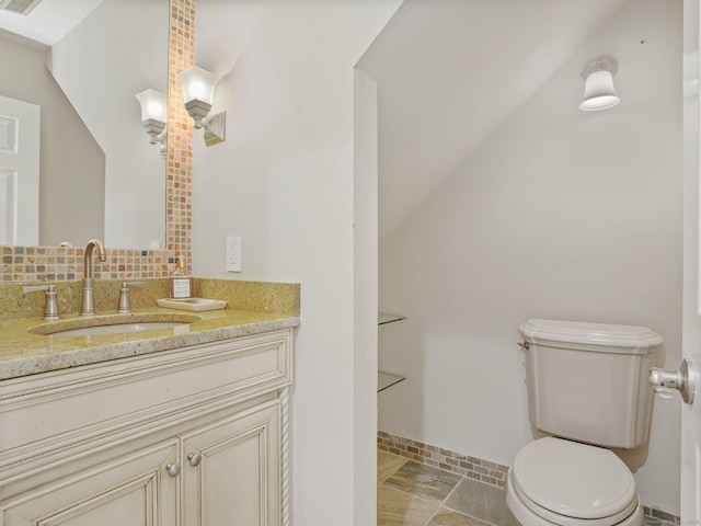 bathroom with toilet and vanity