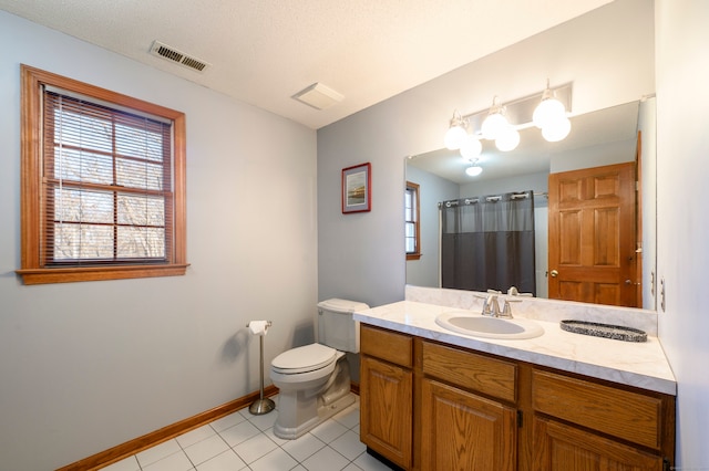 bathroom featuring a shower with curtain, tile patterned flooring, a textured ceiling, toilet, and vanity