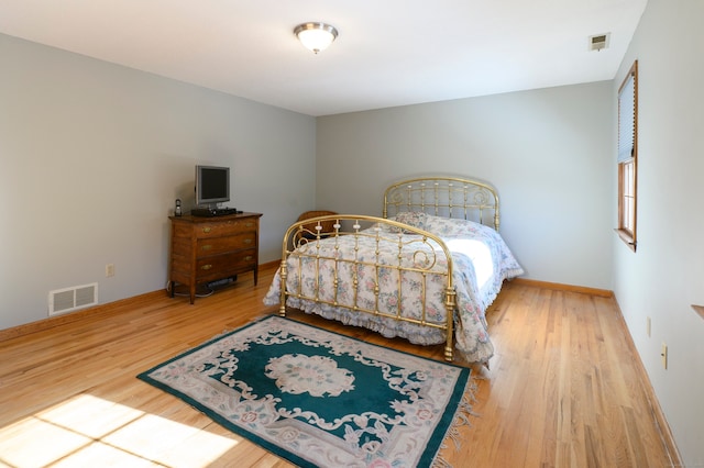 bedroom featuring wood-type flooring