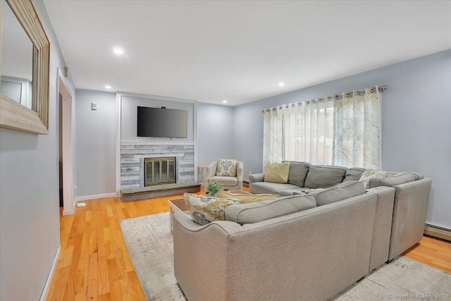 living room featuring a fireplace and hardwood / wood-style flooring