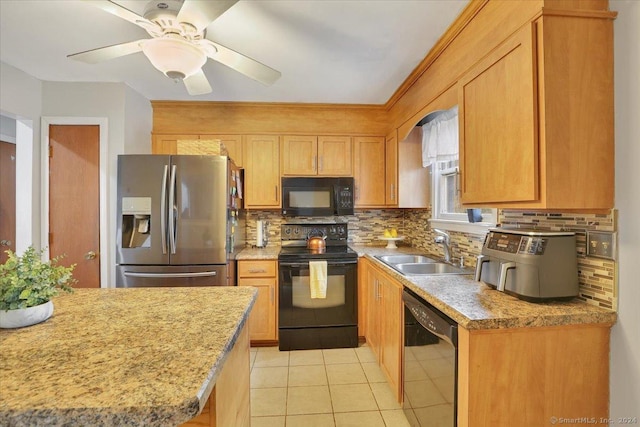 kitchen featuring black appliances, sink, ceiling fan, light tile patterned floors, and tasteful backsplash