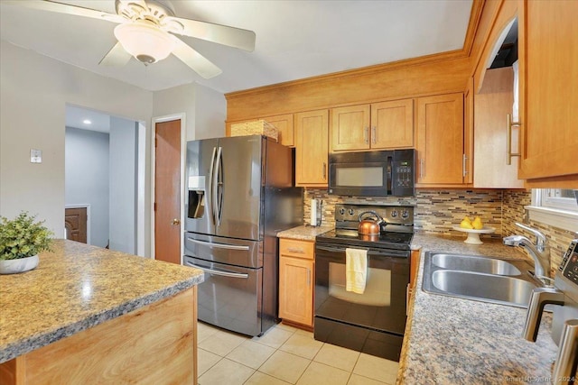 kitchen with ceiling fan, sink, decorative backsplash, light tile patterned flooring, and black appliances