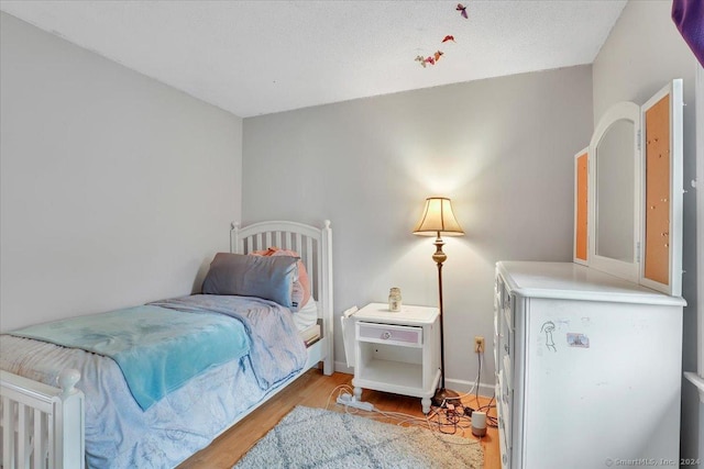 bedroom with light hardwood / wood-style floors