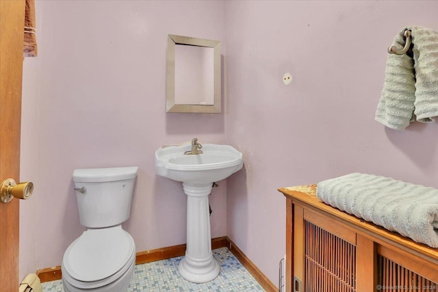 bathroom with tile patterned floors and toilet