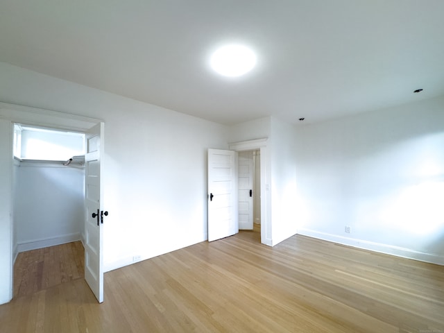 unfurnished bedroom with light hardwood / wood-style floors