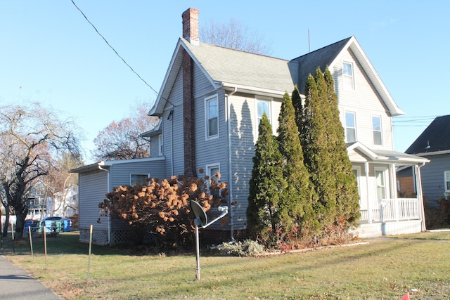 view of home's exterior featuring a yard