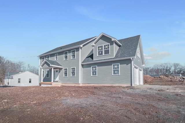 colonial house with roof with shingles