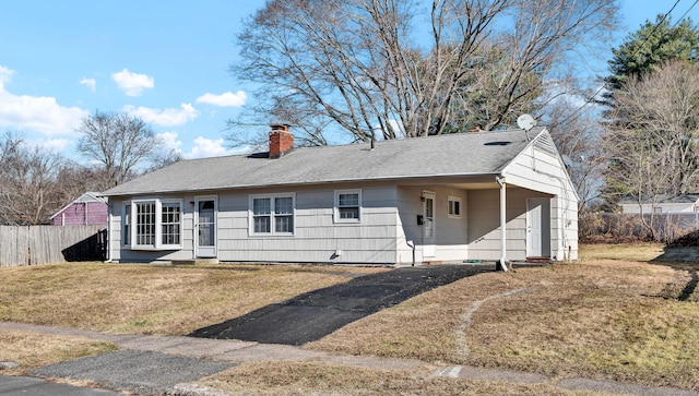 ranch-style home with a front lawn