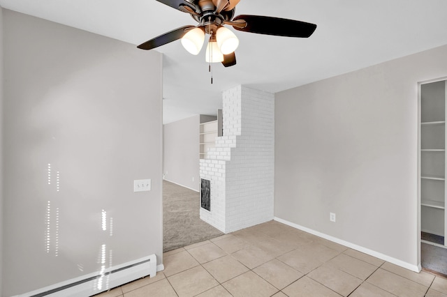 unfurnished living room with ceiling fan, light tile patterned floors, and a baseboard radiator