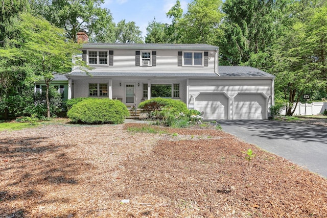 front of property with a garage