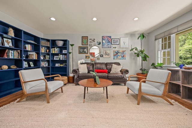 living area with baseboard heating and light wood-type flooring