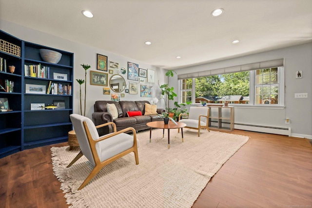 living room with light hardwood / wood-style flooring and a baseboard radiator