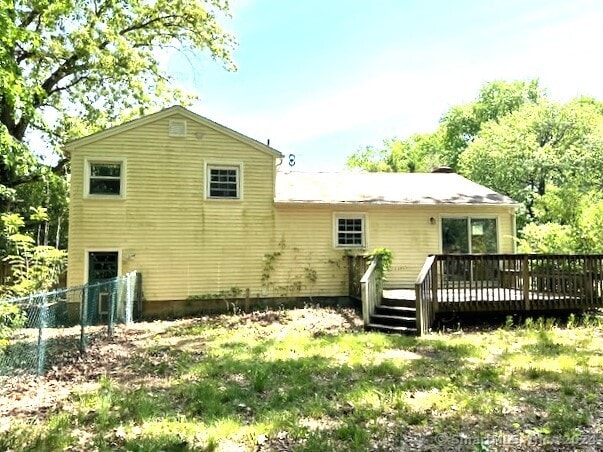 rear view of house with a wooden deck