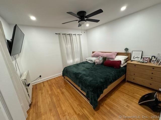 bedroom featuring ceiling fan and light wood-type flooring