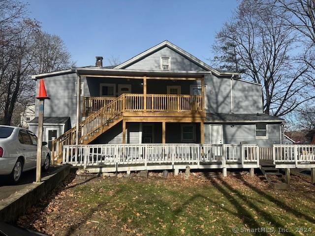 rear view of property with a deck