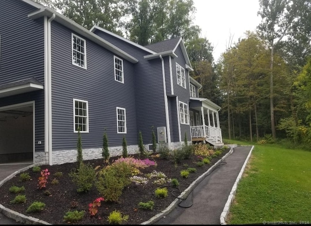 view of home's exterior with a yard