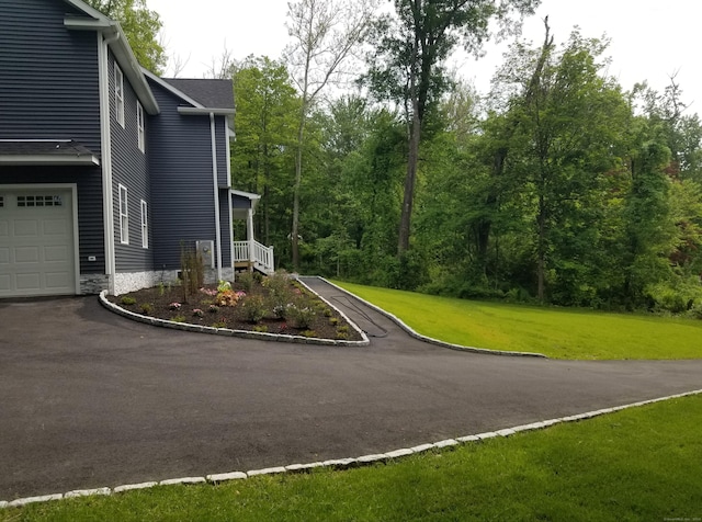 exterior space with a lawn and a garage