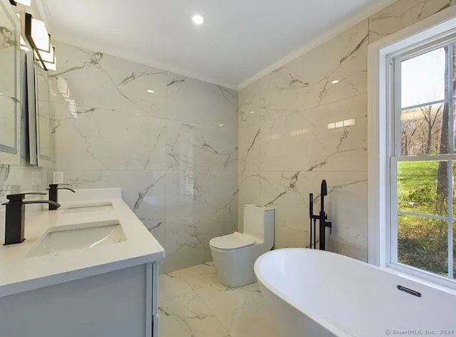 bathroom featuring plenty of natural light, a bathtub, tile walls, and vanity