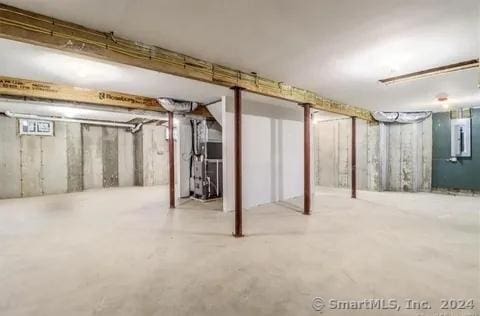 basement with heating unit and electric panel