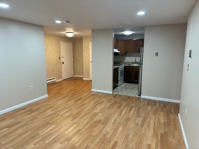 kitchen featuring dark brown cabinetry, sink, a baseboard radiator, light hardwood / wood-style floors, and stainless steel electric range oven