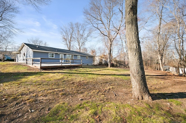 view of yard with a wooden deck