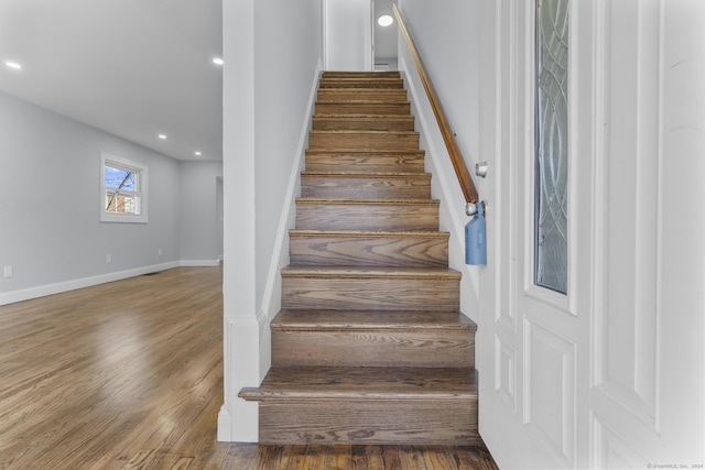 stairway with wood-type flooring