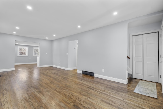 unfurnished living room featuring hardwood / wood-style flooring