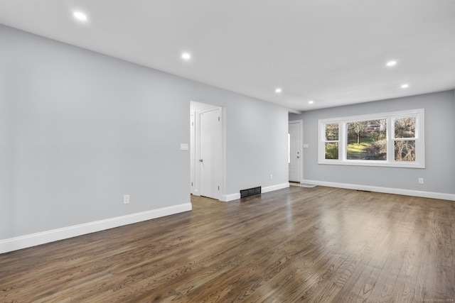 empty room featuring dark wood-type flooring