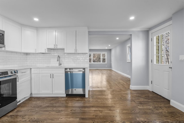 kitchen featuring sink, white cabinets, plenty of natural light, and appliances with stainless steel finishes