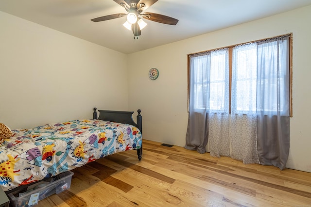 bedroom featuring light wood-type flooring and ceiling fan