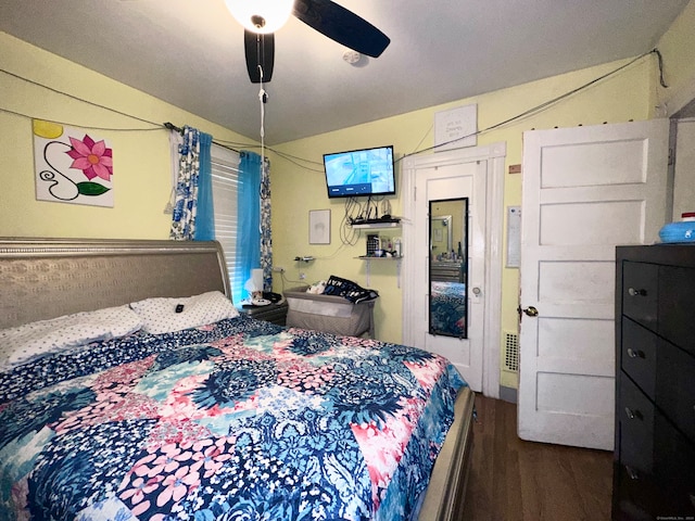 bedroom featuring hardwood / wood-style floors and ceiling fan