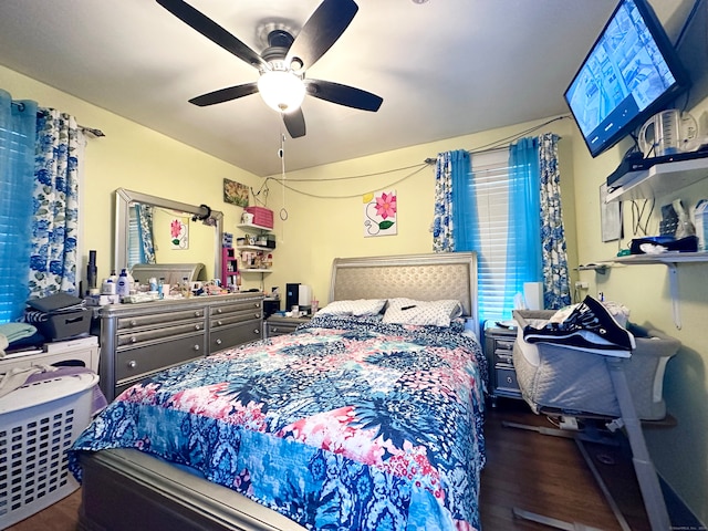 bedroom with ceiling fan and dark hardwood / wood-style floors