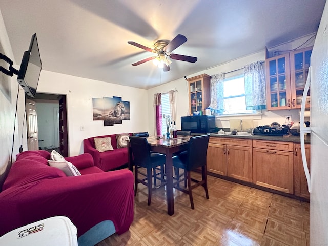 dining room featuring parquet flooring and ceiling fan