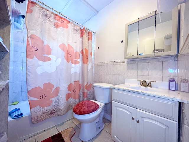 full bathroom featuring tile patterned floors, tile walls, toilet, vanity, and shower / tub combo