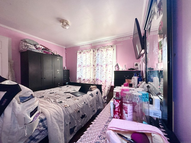 bedroom with crown molding