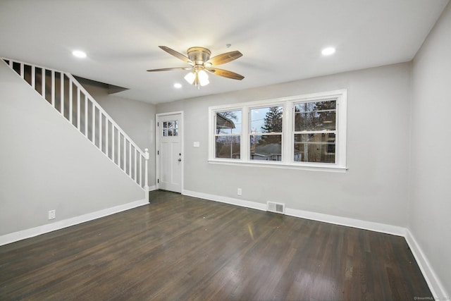 foyer with dark hardwood / wood-style floors and ceiling fan