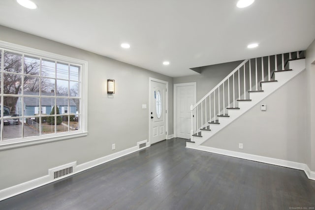 entryway with dark wood-type flooring