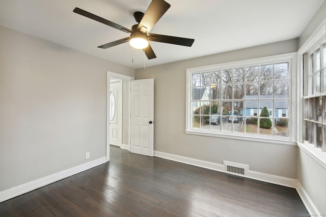 unfurnished room featuring ceiling fan and dark hardwood / wood-style flooring