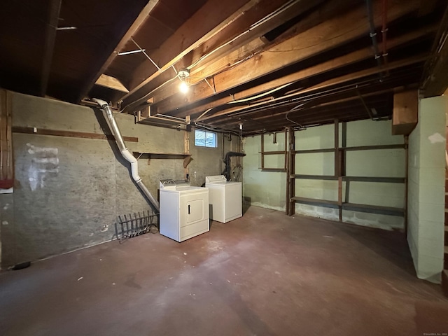 basement with washer and clothes dryer