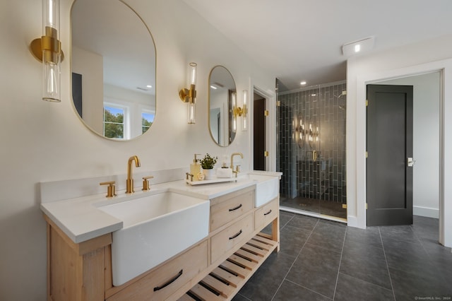 bathroom featuring tile patterned flooring, vanity, and a shower with door