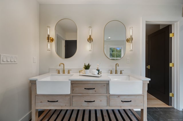 bathroom featuring tile patterned flooring and vanity