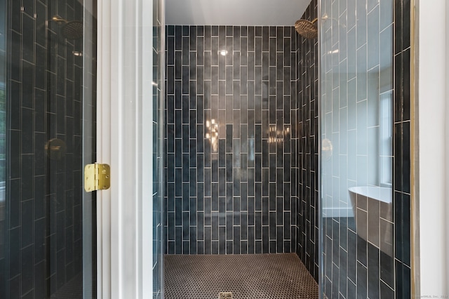 bathroom with a tile shower