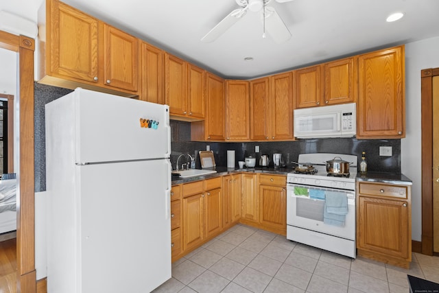 kitchen featuring backsplash, white appliances, ceiling fan, sink, and light tile patterned floors